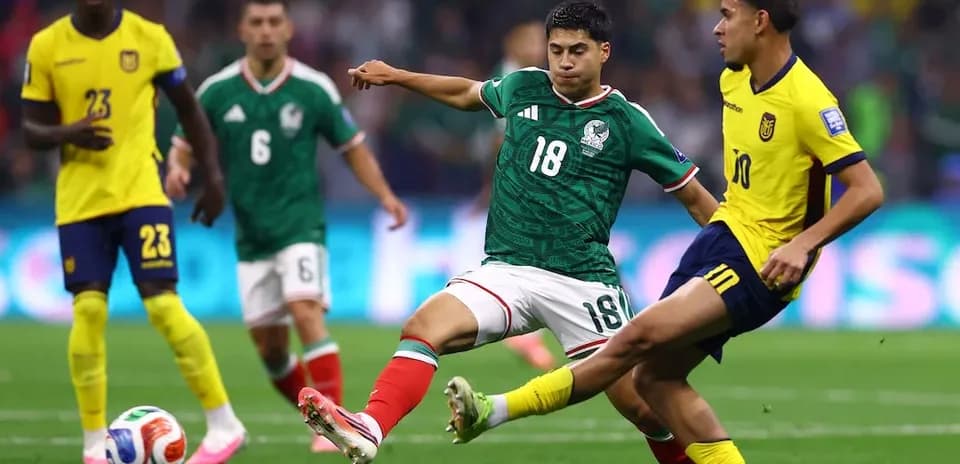 Mexico player challenges Ecuador opponent during match