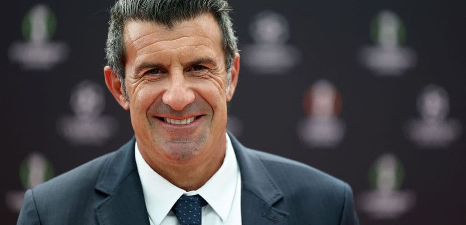 Smiling man in suit at press event