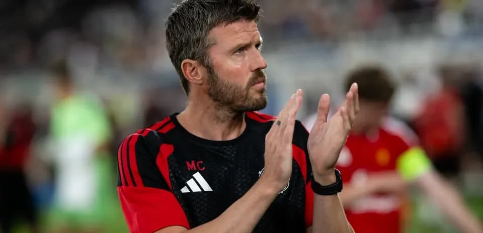 Coach applauding players on the field