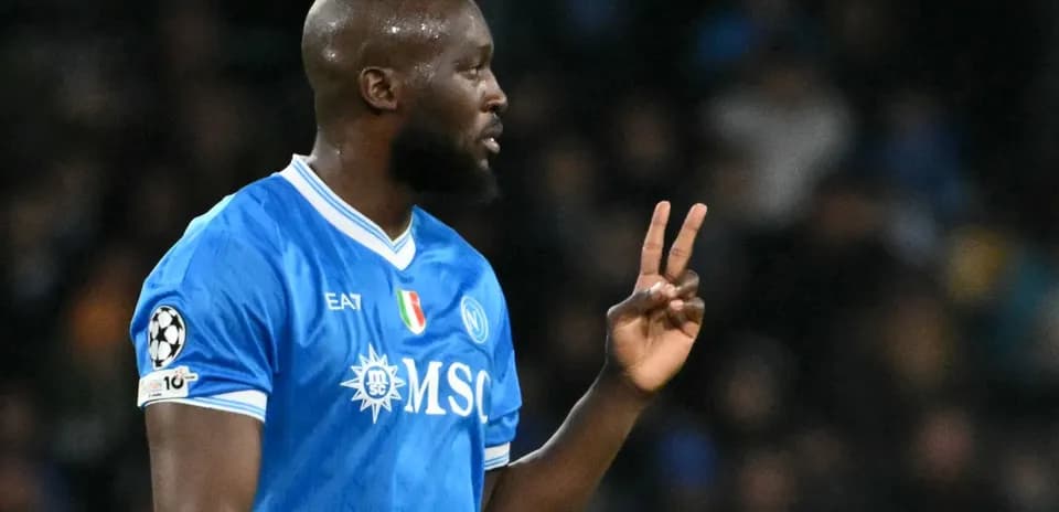 Player gesturing during match wearing Napoli jersey