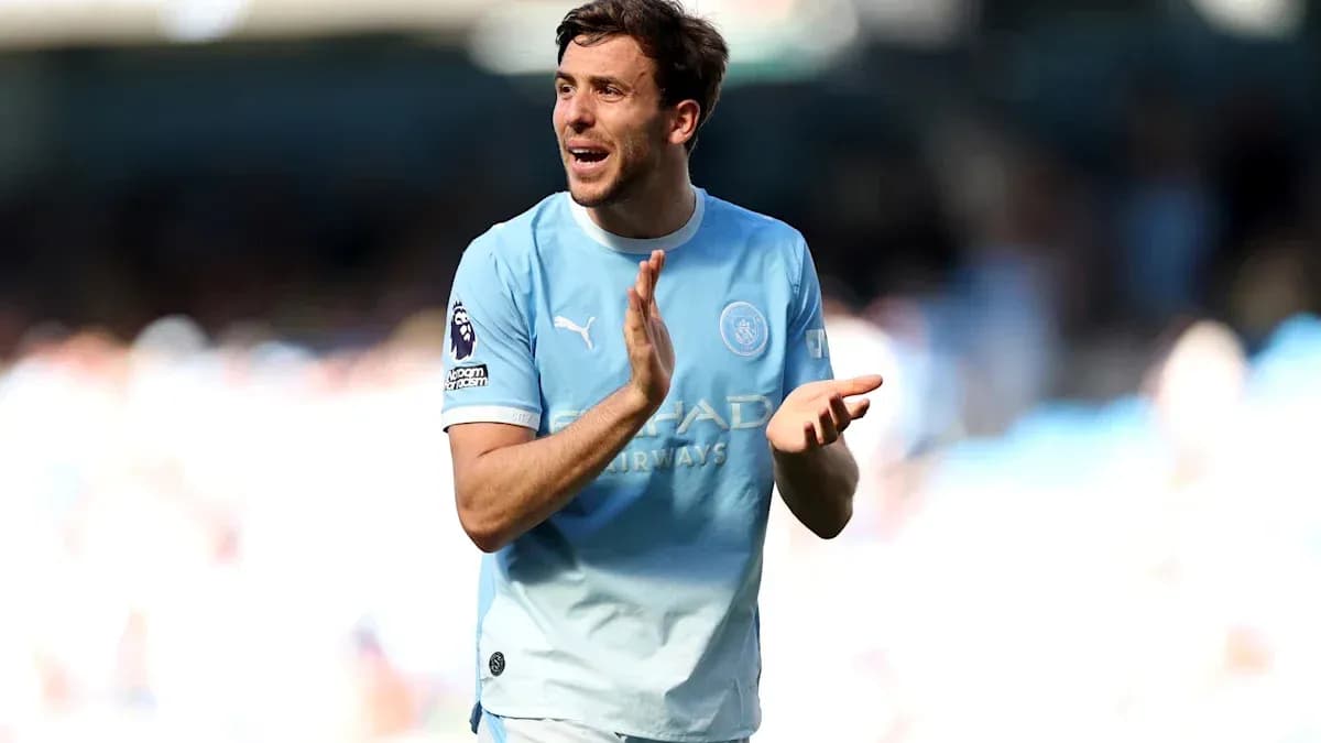 Player in light blue jersey applauding fans