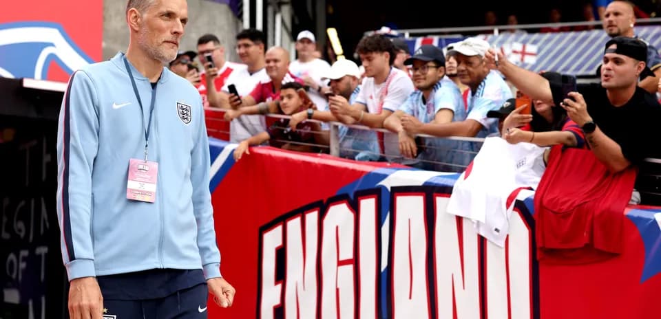 Manager walking past fans before the match