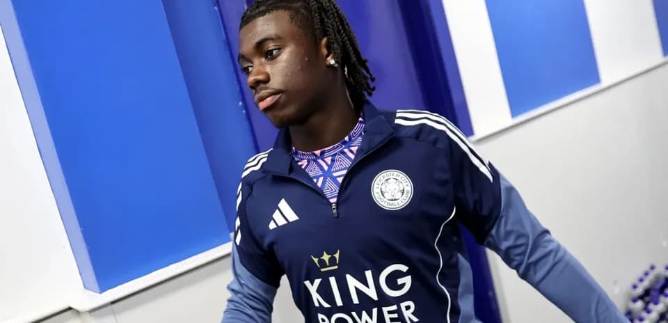 Player wearing Leicester City training gear in hallway