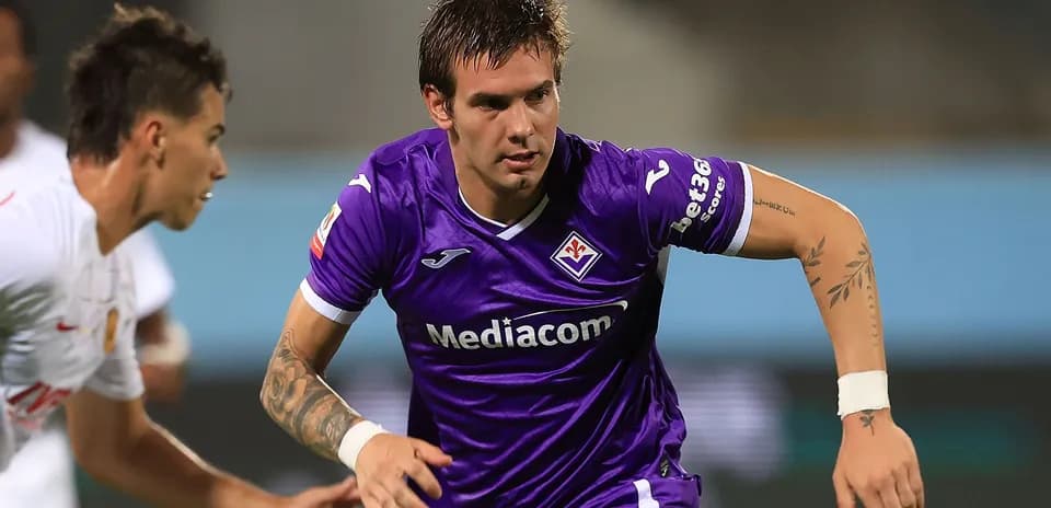 Player in purple kit sprinting during match
