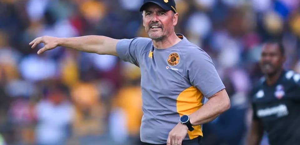 Coach gesturing during a match on the sidelines