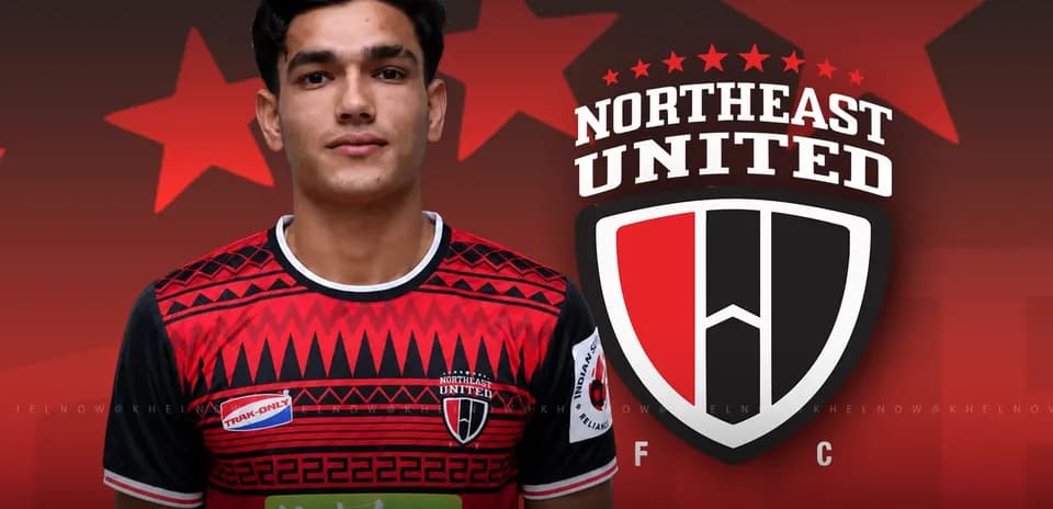 Player in Northeast United FC jersey posing for photo