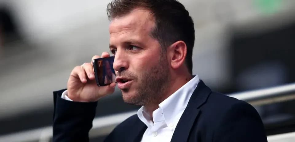 Person talking on the phone in a stadium
