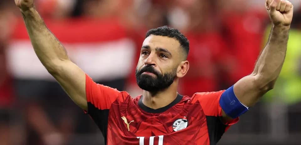 Player celebrating with raised fist in Egypt jersey