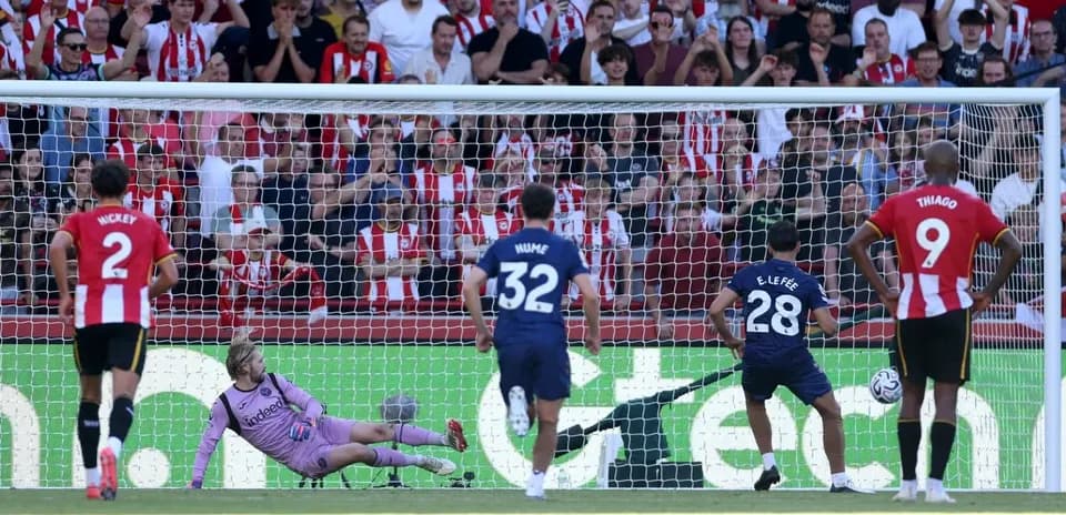 Penalty kick being taken during football match