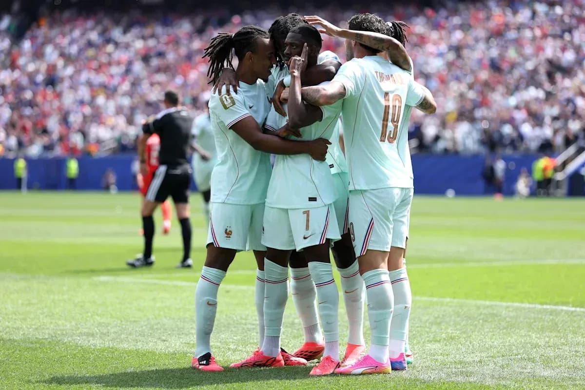 France players celebrating a goal on the field