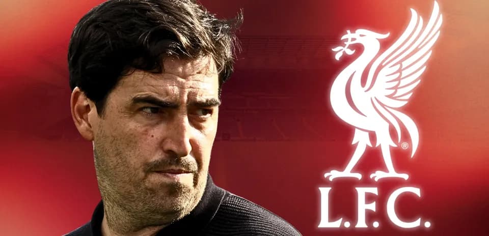Coach with Liverpool logo in background