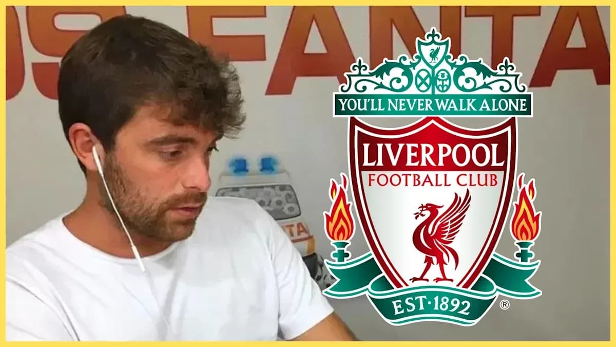 Person with headphones near Liverpool FC logo