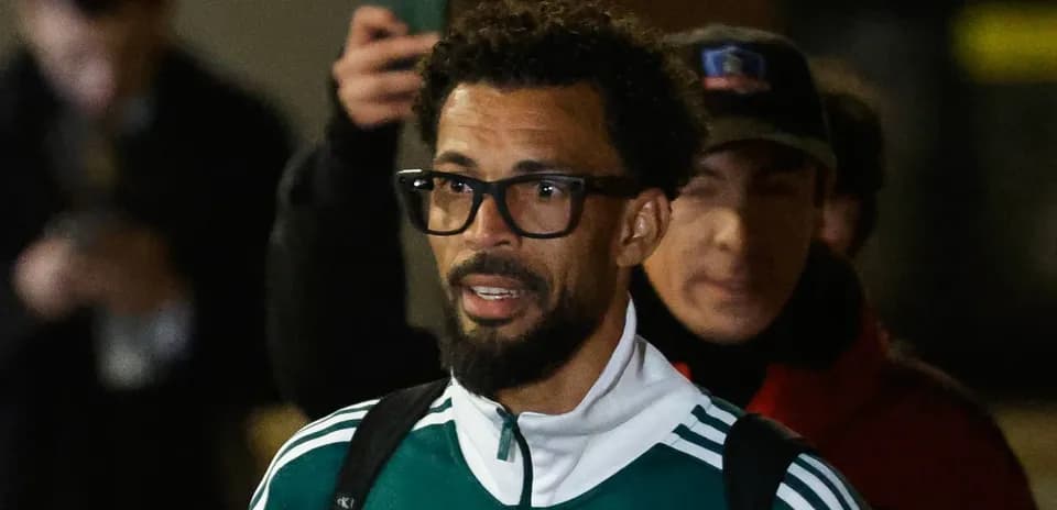 Player wearing glasses arriving at event venue