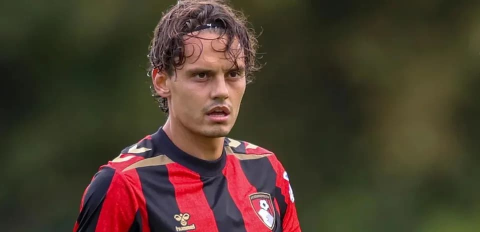 Player in red and black jersey during training session