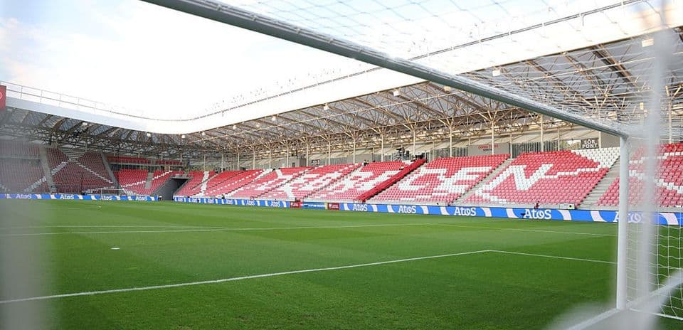 View of a football stadium from behind the goal