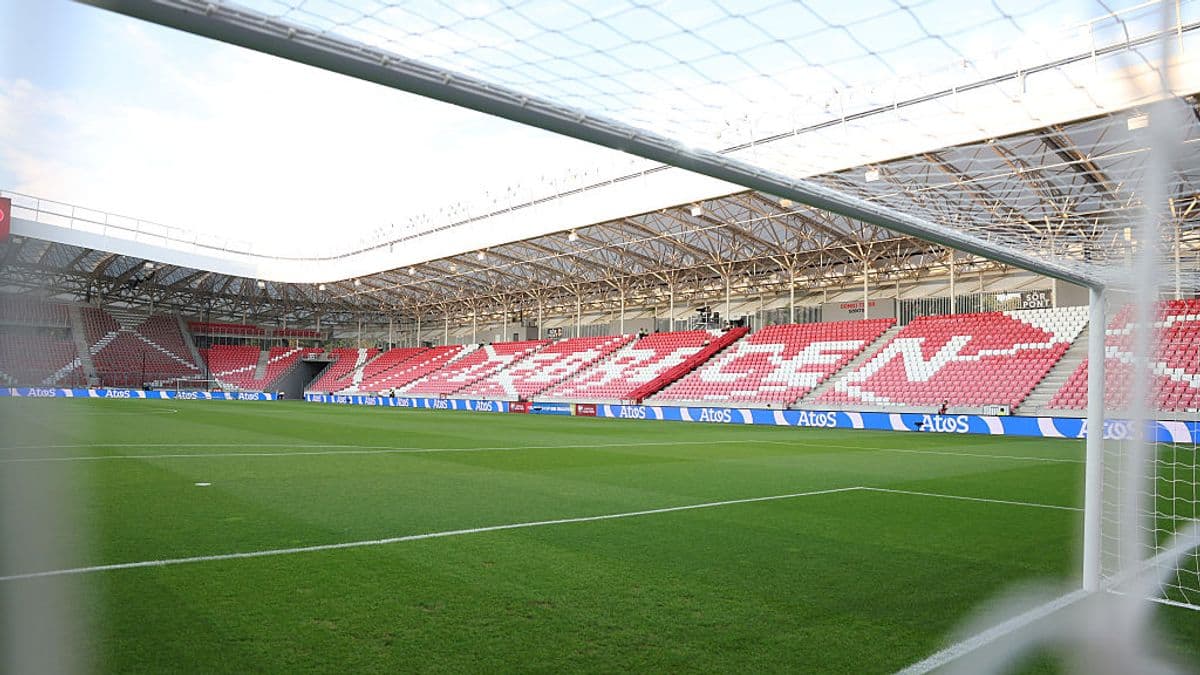 View of a football stadium from behind the goal