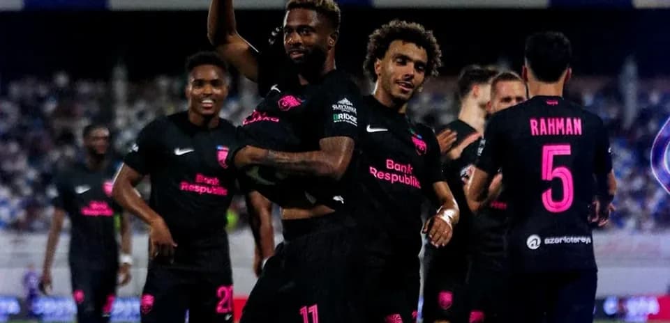 Players celebrating after a goal in football match