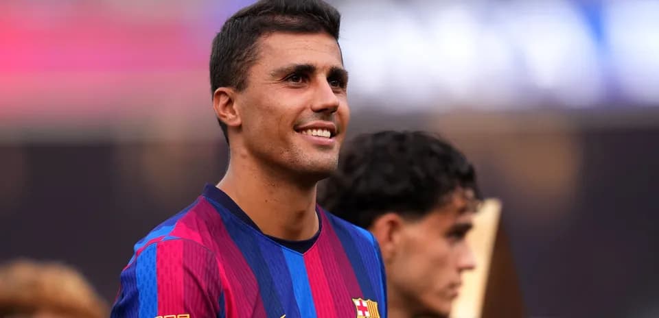 Player smiling while wearing Barcelona jersey