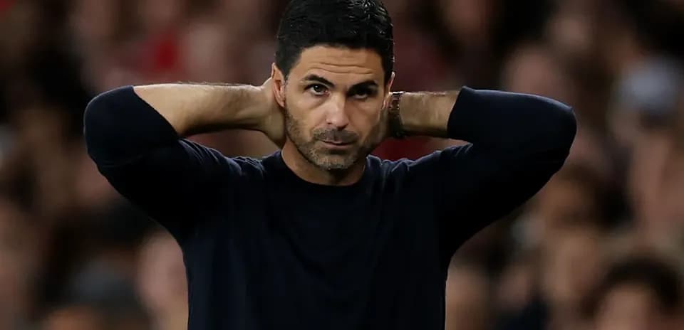 Manager with hands on head during match