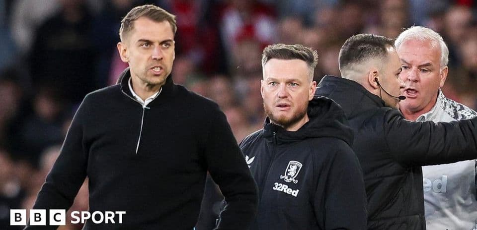 Coaches and staff reacting during a tense moment