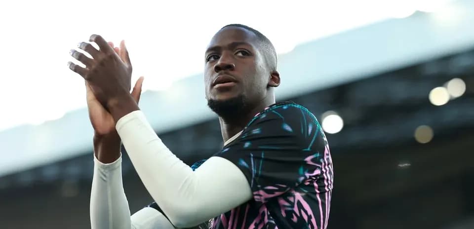 Player applauding fans during pre-match warm-up
