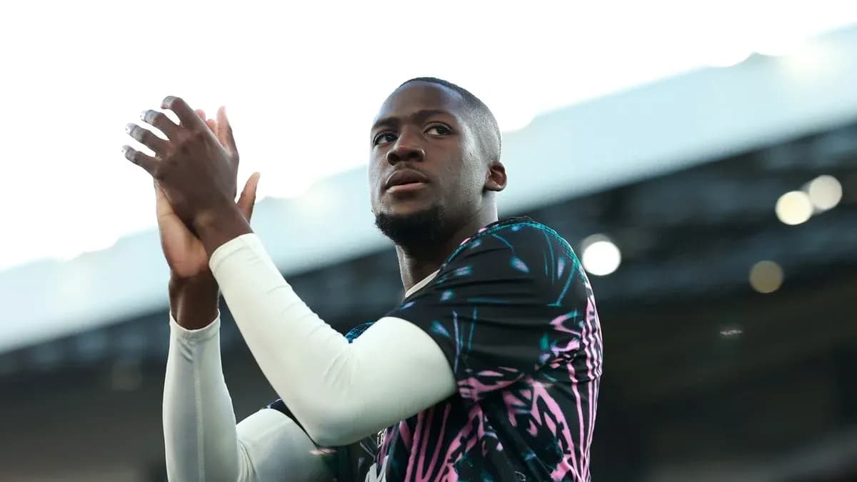 Player applauding fans during pre-match warm-up