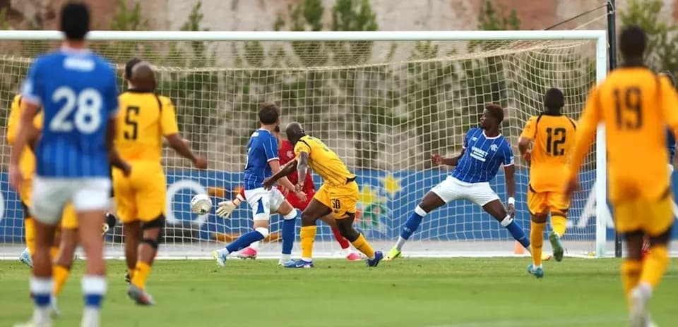Player attempting to score during soccer match