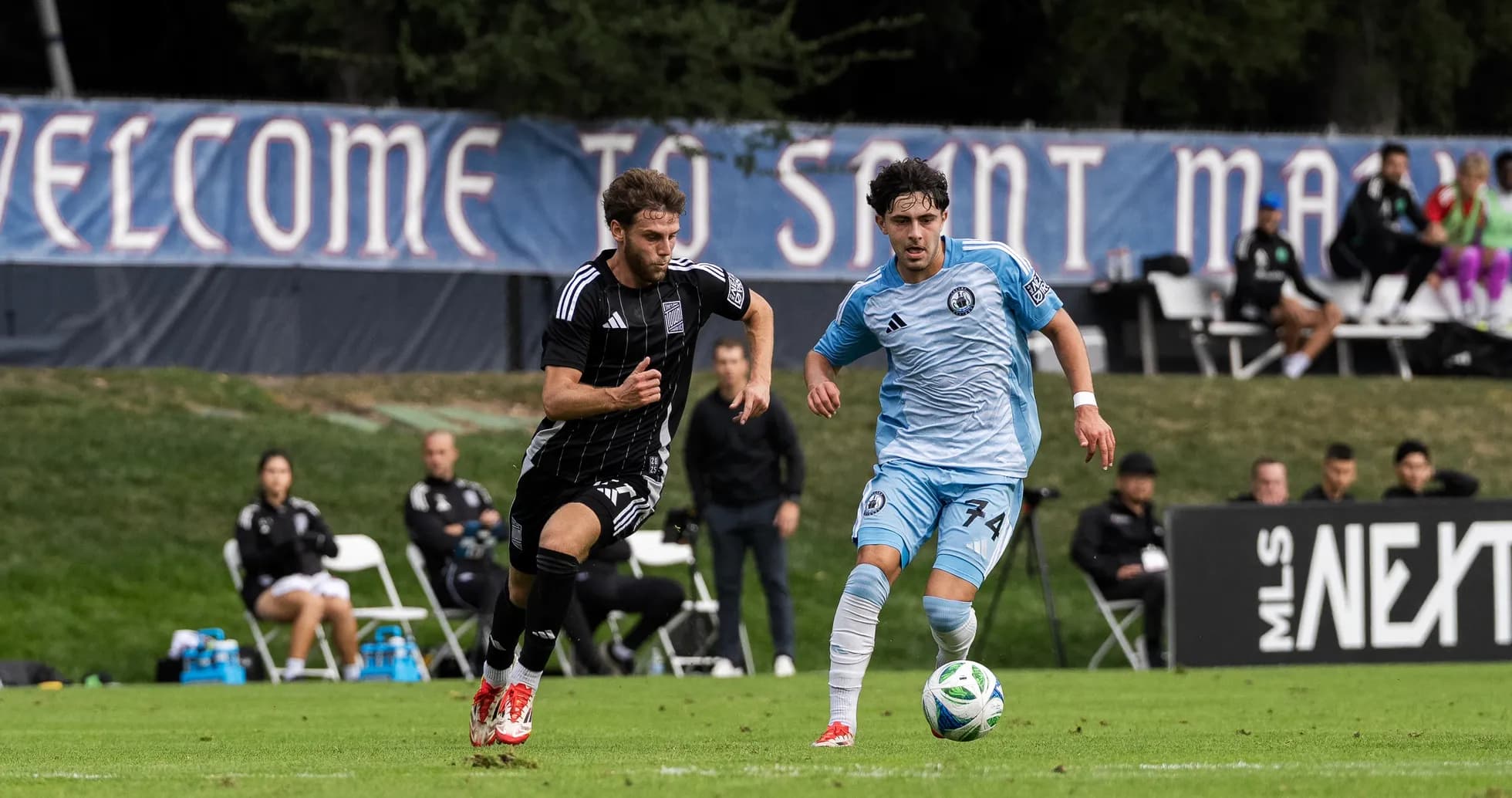 Player competing for the ball during MLS Next Pro match