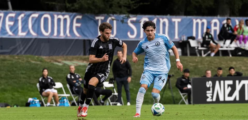 Player competing for the ball during MLS Next Pro match