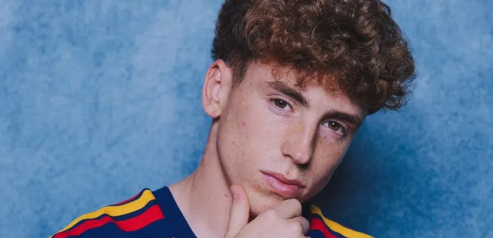 Young man posing with hand on chin