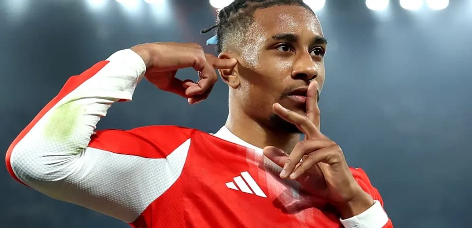 Player celebrating with shushing gesture after scoring