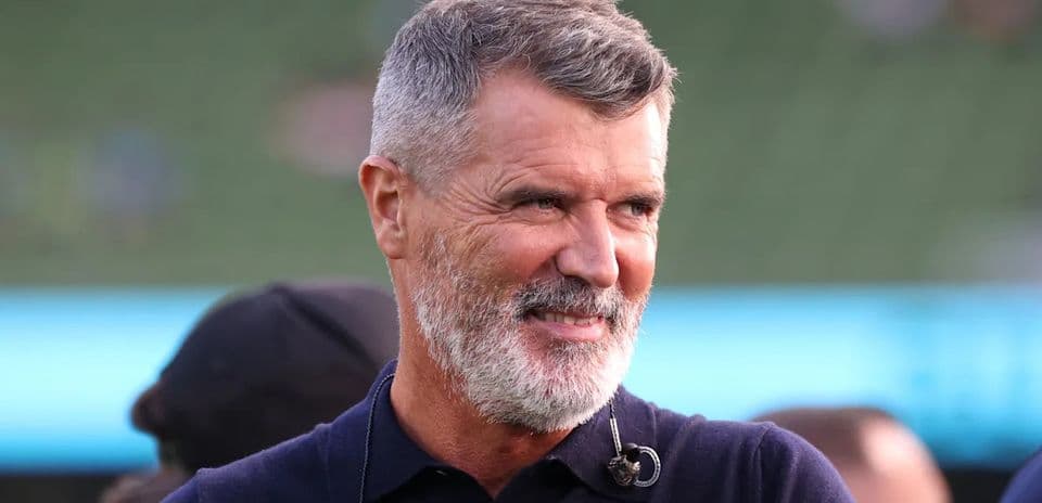 Man with grey beard smiling at event