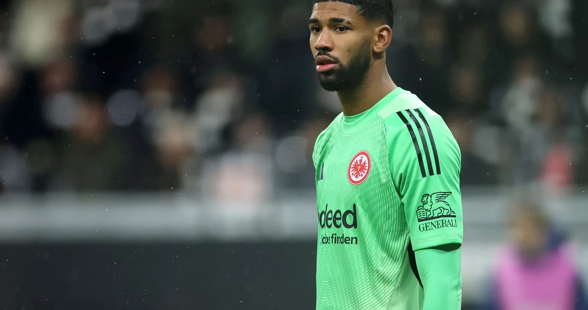 Goalkeeper in green kit during match