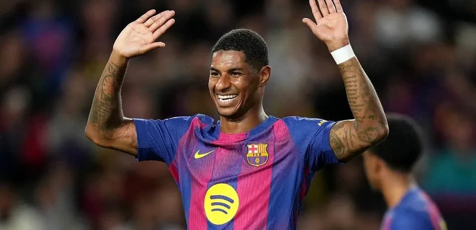 Player celebrating with raised hands on the field