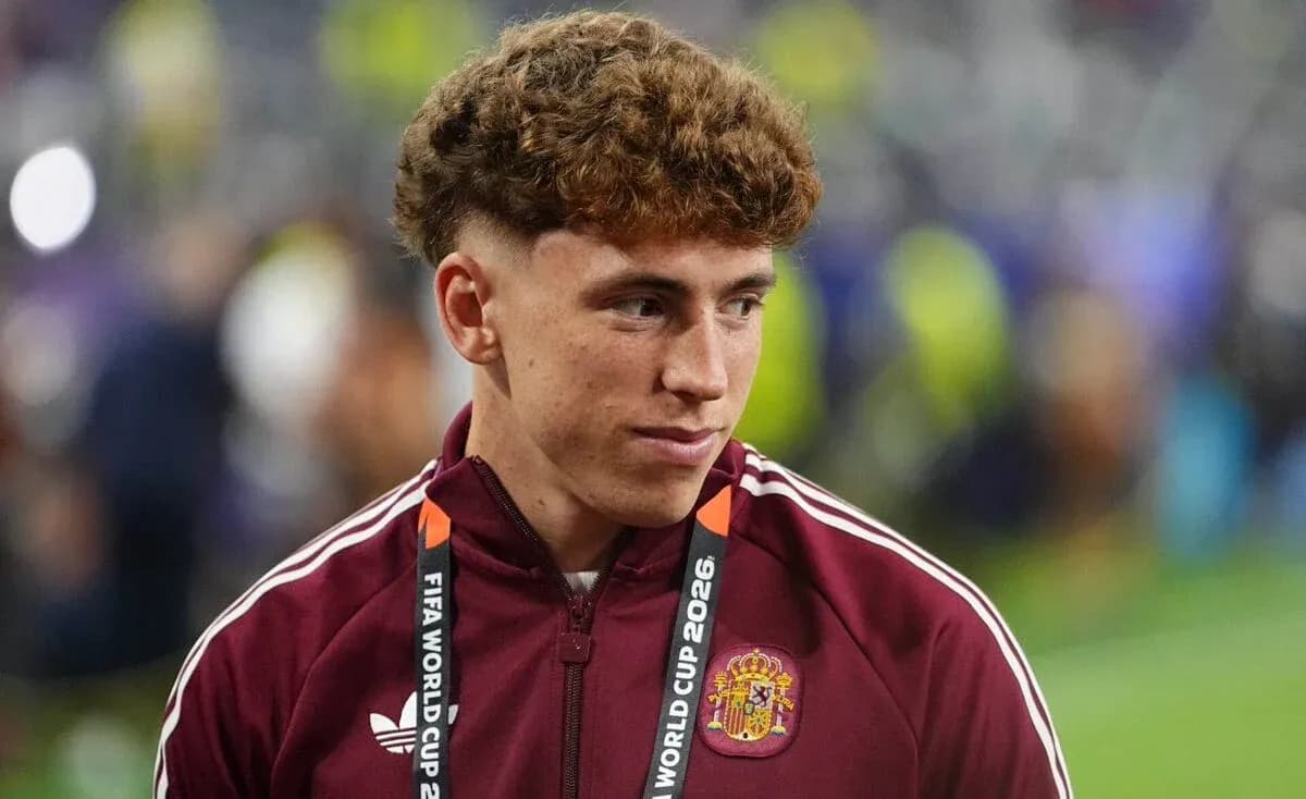 Player wearing maroon jacket with FIFA World Cup 2026 lanyard