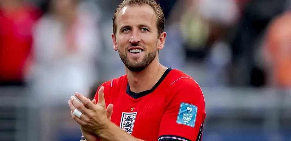 Player celebrating and clapping in red jersey