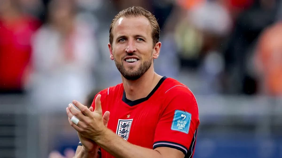 Player celebrating and clapping in red jersey