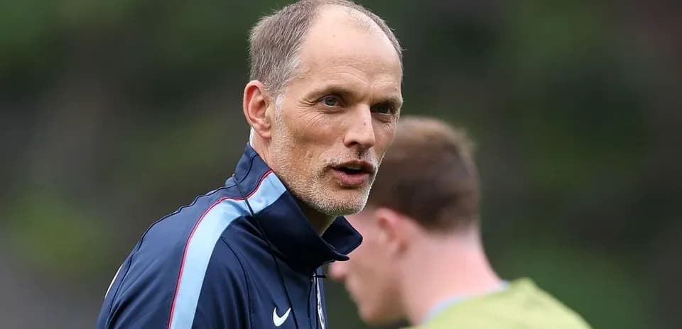Coach speaking during training session with players