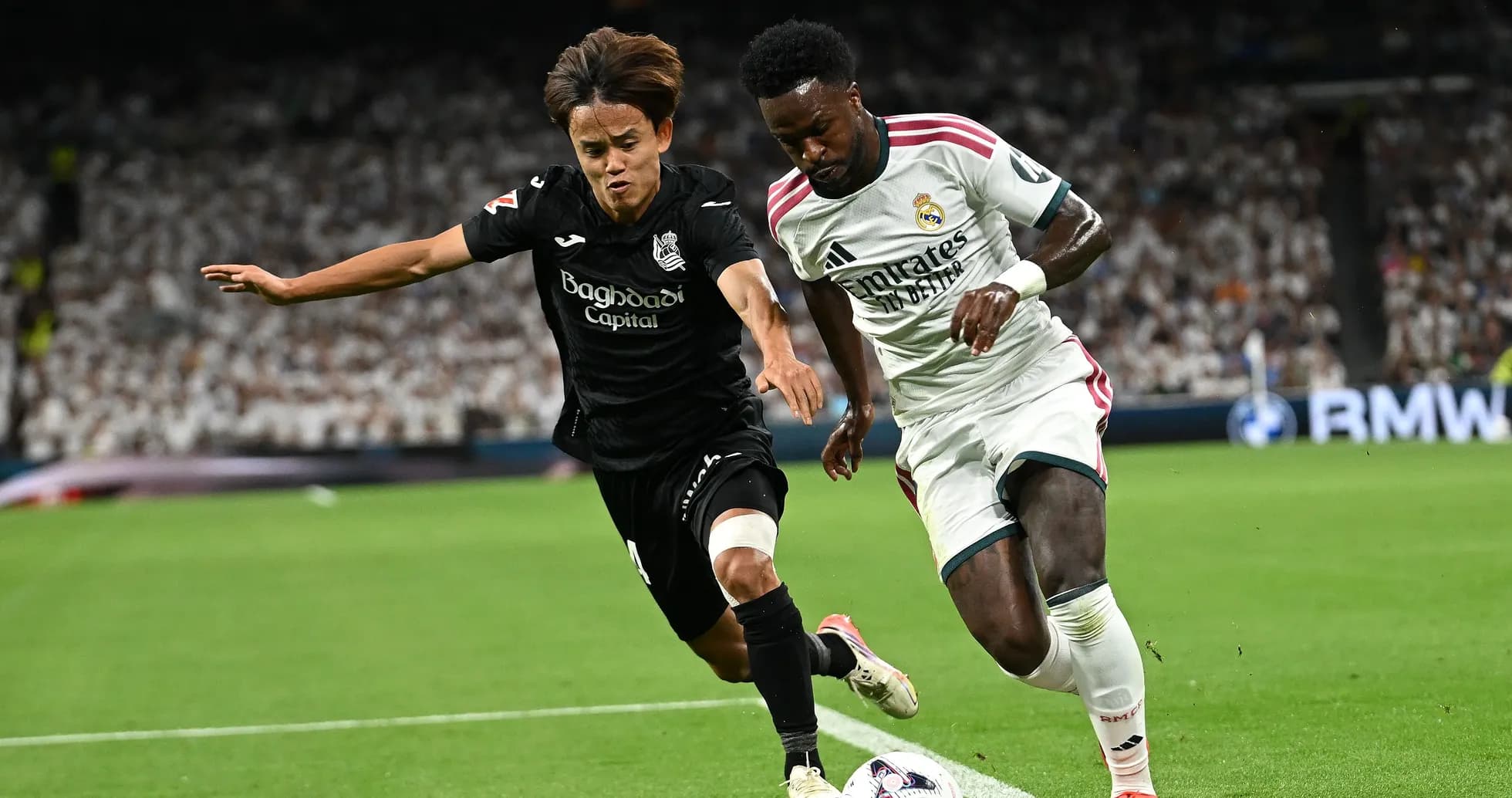 Two players competing for the ball on the field