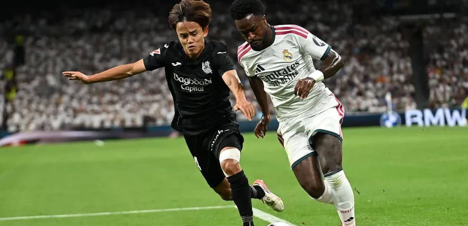 Two players competing for the ball on the field