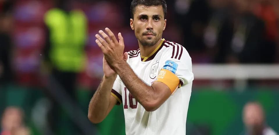 Player applauding fans during a match