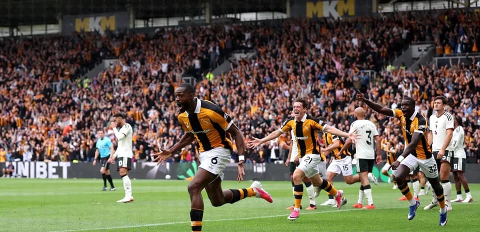 Player celebrating goal with teammates during match