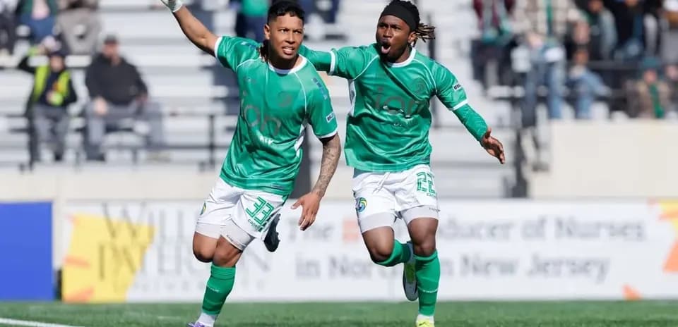 Players celebrating a goal during USL match