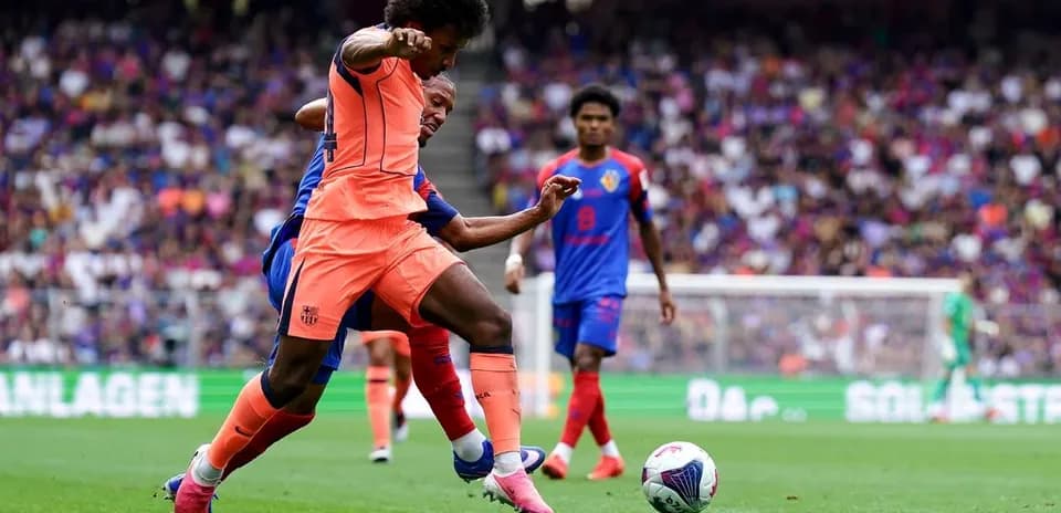 Player tackling opponent during football match action