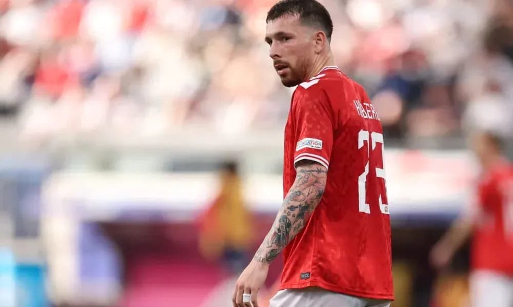 Player in red jersey during football match