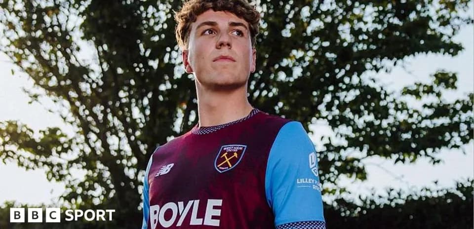 Player posing in West Ham United jersey outdoors