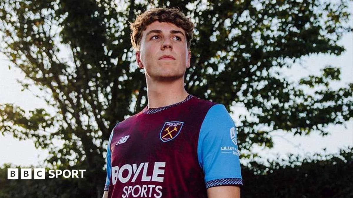 Player posing in West Ham United jersey outdoors