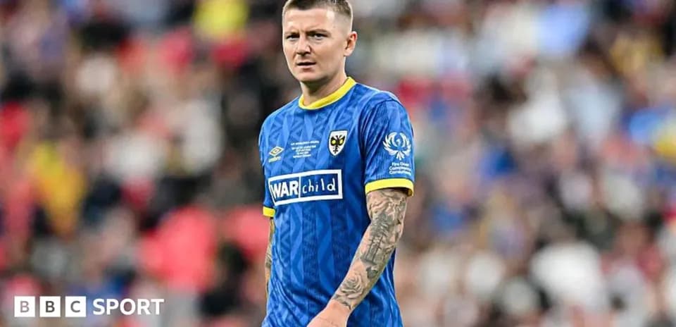 Player wearing blue kit on football pitch