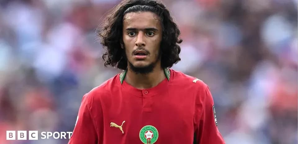 Player in red Morocco jersey during match