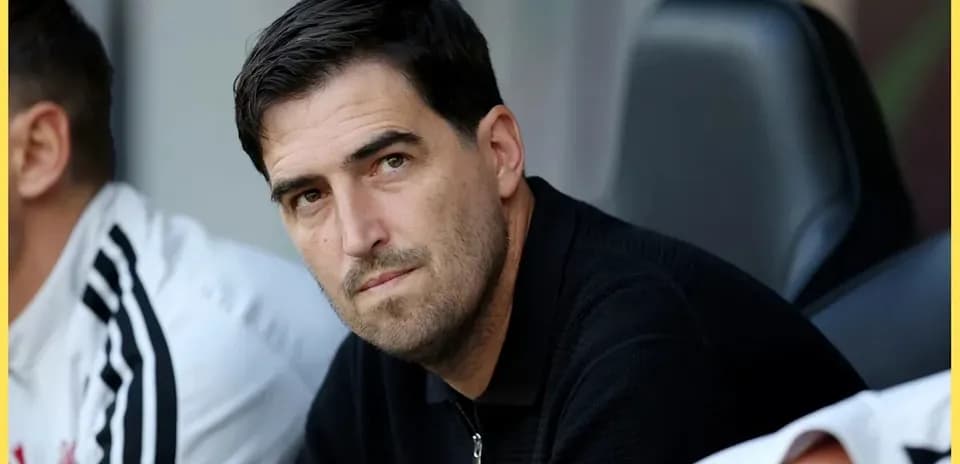Coach observing from the sidelines during a match